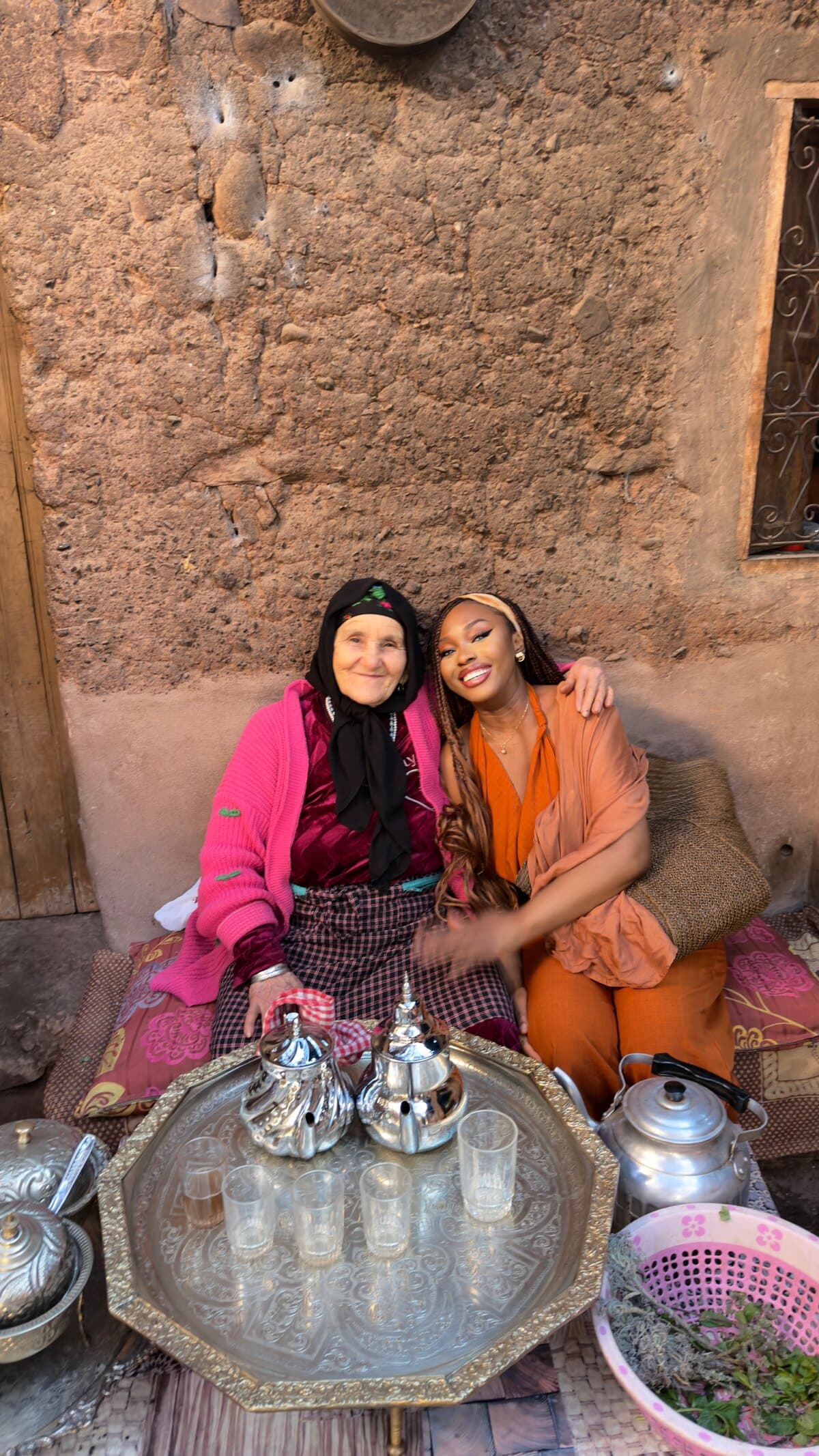 Martha sharing tea with an elder in Morocco